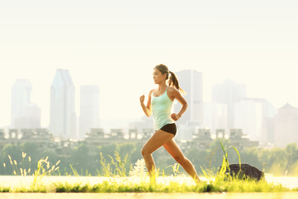 A woman with a ponytail running Stock Photo