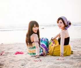 Asian girl sitting on the beach Stock Photo