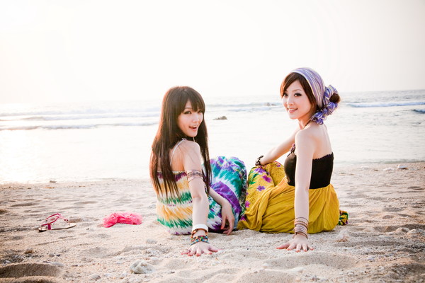 Asian girl sitting on the beach Stock Photo