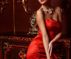 Beautiful woman wearing red evening dress Stock Photo