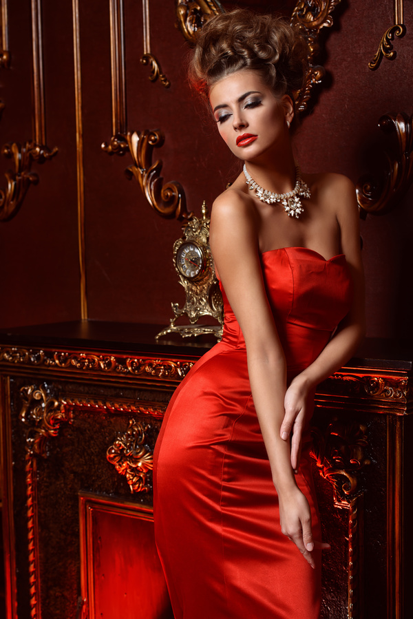 Beautiful woman wearing red evening dress Stock Photo
