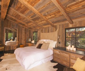 Bedroom with double bed in the hut Stock Photo