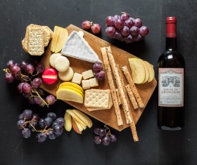 Biscuits and red wine grapes Stock Photo