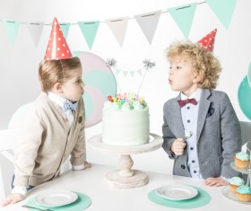 Blowing birthday candles for kids Stock Photo