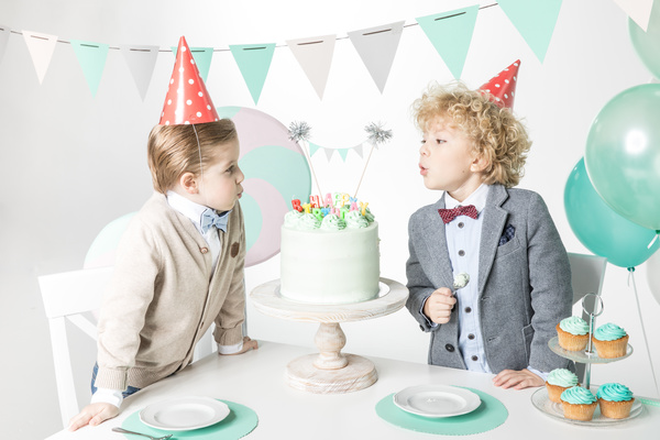 Blowing birthday candles for kids Stock Photo