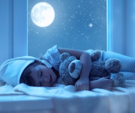 Bright moon shone on the sleeping girl Stock Photo