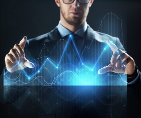 Businessman with virtual charts Stock Photo 01