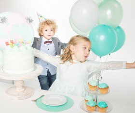 Children at the birthday table Stock Photo
