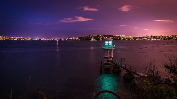 City night view and pier lighthouse Stock Photo