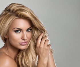 Comb the hair of the woman Stock Photo