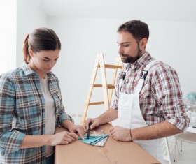 Couples choose wall colors Stock Photo