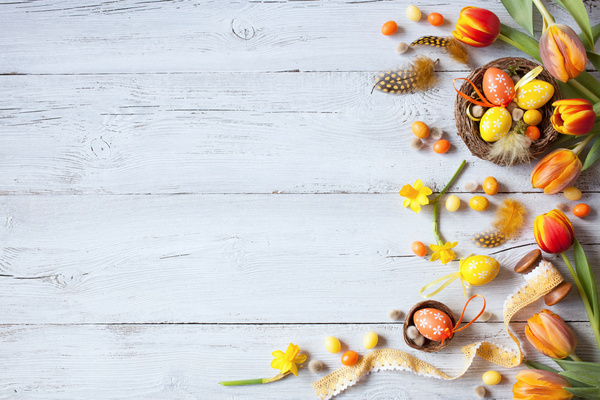 Easter wooden background with eggs, candy and flowers Stock Photo 02