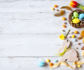Easter wooden background with eggs, candy and flowers Stock Photo 05