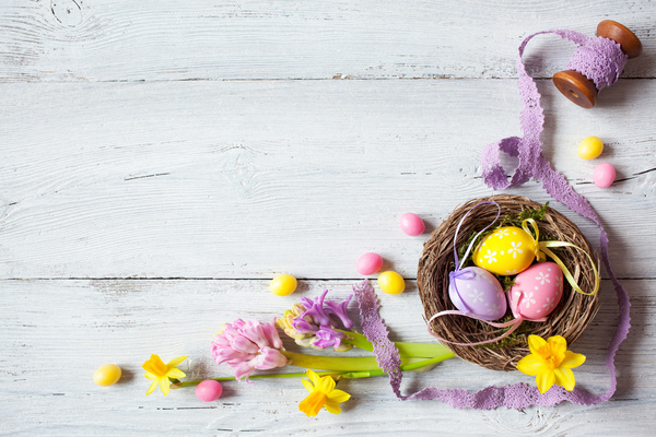 Easter wooden background with eggs, candy and flowers Stock Photo 08