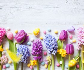 Easter wooden background with eggs, candy and flowers Stock Photo 09
