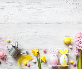 Easter wooden background with eggs, candy and flowers Stock Photo 11