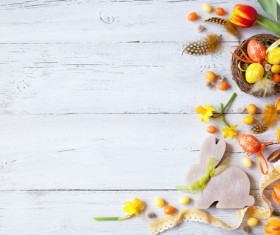 Easter wooden background with eggs, candy and flowers Stock Photo 12