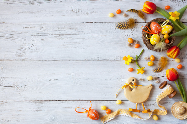 Easter wooden background with eggs, candy and flowers Stock Photo 13