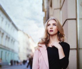 Fashionable blonde girl walking in the city Stock Photo 02