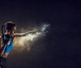 Fists in front of a black background female boxer Stock Photo