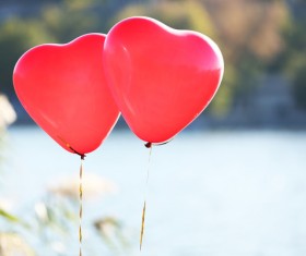 Floating two red balloons Stock Photo