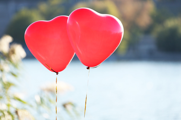 Floating two red balloons Stock Photo