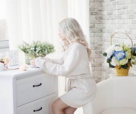 Girl sitting on the arm of the sofa HD picture