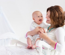 Happy baby with smiling mom Stock Photo