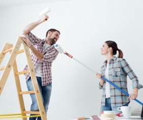 Happy couple's new home decoration Stock Photo