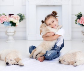 Happy little girl hugging the dog Stock Photo