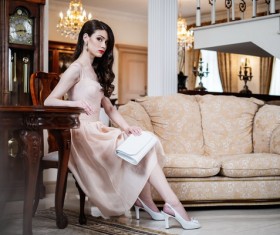 High cold beauty sitting on a chair Stock Photo