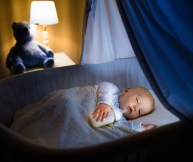 Holding a bottle of baby to sleep Stock Photo