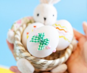 Holding a decorated Easter eggs HD picture