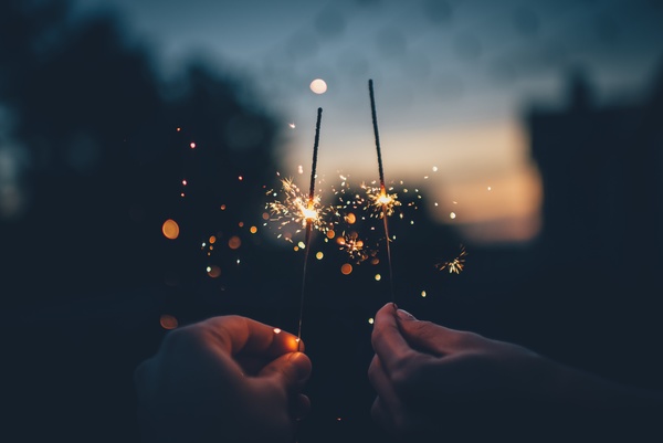 Holding burning fireworks Stock Photo
