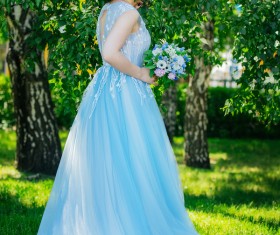 Holding the blossoming blue skirt red lip beauty Stock Photo