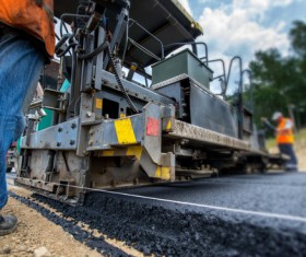 Laying asphalt pavement Stock Photo