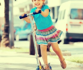 Little girl playing with a unicycle HD picture