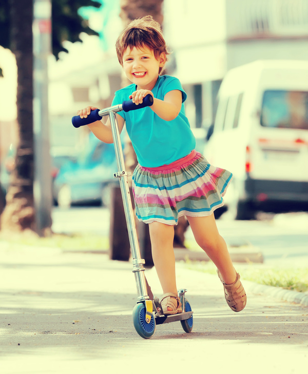 Little girl playing with a unicycle HD picture