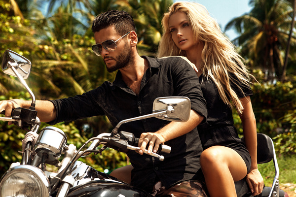 Man riding on a motorcycle with girlfriend Stock Photo