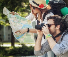 Maps and signs pointing tourists taking pictures Stock Photo