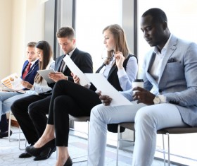 Men and women holding personal data waiting for interview HD picture