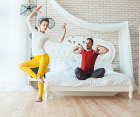 Men and women practicing yoga at home Stock Photo 03