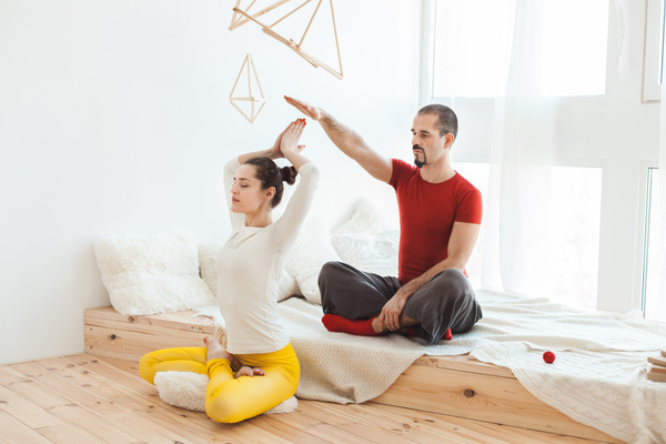 Men and women practicing yoga at home Stock Photo 04