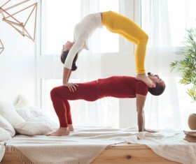 Men and women practicing yoga at home Stock Photo 06