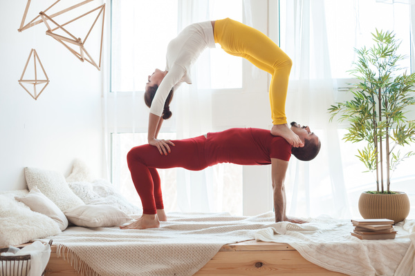Men and women practicing yoga at home Stock Photo 06