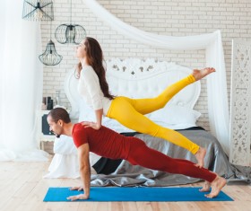 Men and women practicing yoga at home Stock Photo 07