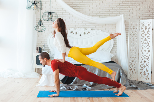 Men and women practicing yoga at home Stock Photo 07