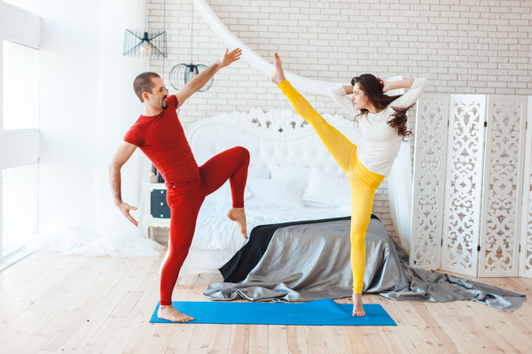 Men and women practicing yoga at home Stock Photo 09