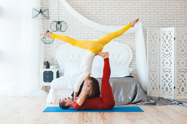 Men and women practicing yoga at home Stock Photo 10