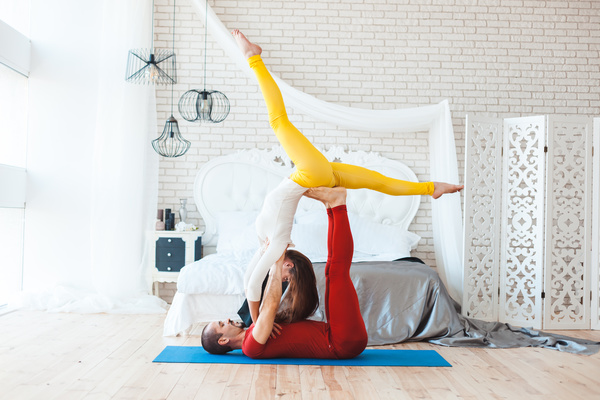 Men and women practicing yoga at home Stock Photo 11